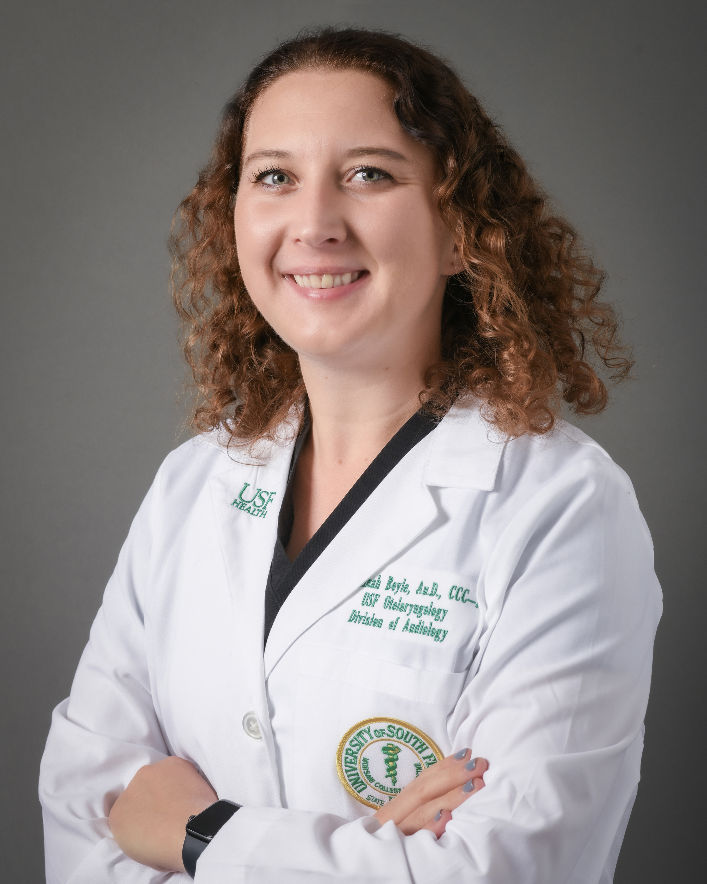 Suzannah Boyle in white coat with USF Health Audiology