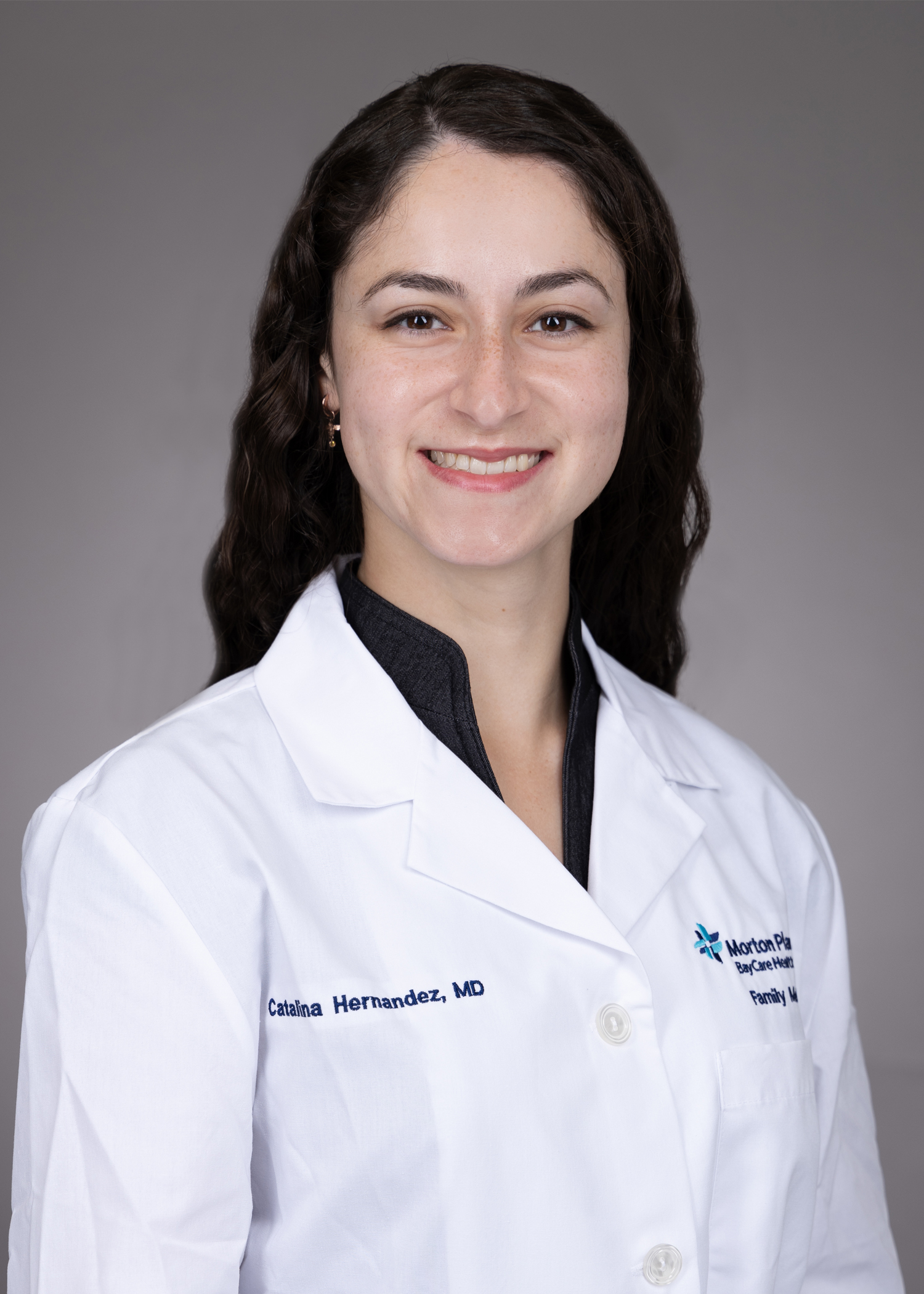 Catalina Hernandez with USF Health Family Medicine Residency in a white lab coat