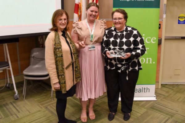 Alumni Officer Liz Bannon and Dr. Ellen Daley standing with the 2025 Outstanding Alumni Awardee