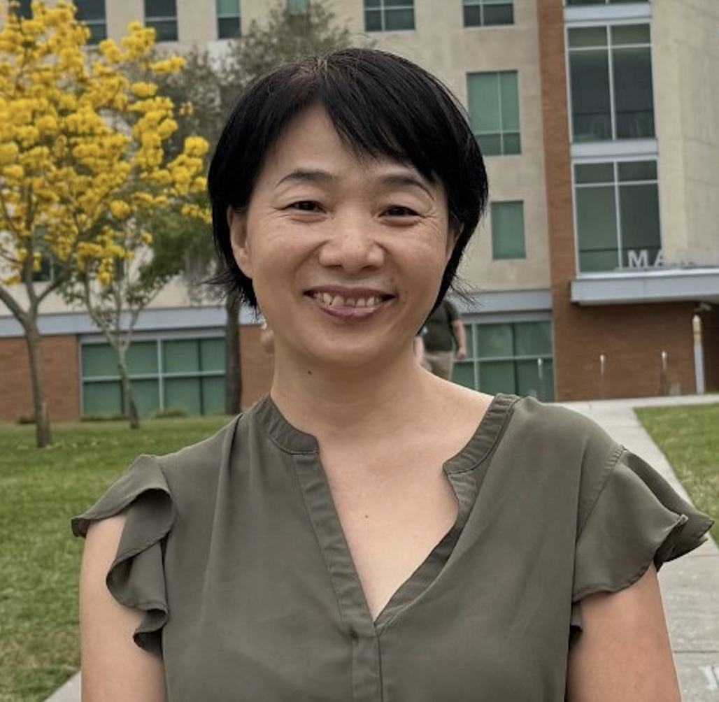 A headshot of Dr. Xiaoli Zhang in an outdoor setting