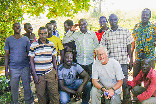 USF Health’s Thomas Unnasch, one of the world’s leading experts on onchocerciasis, with a local team in Uganda employed to help with collection and control of the black flies that spread the sight-robbing parasitic infection.