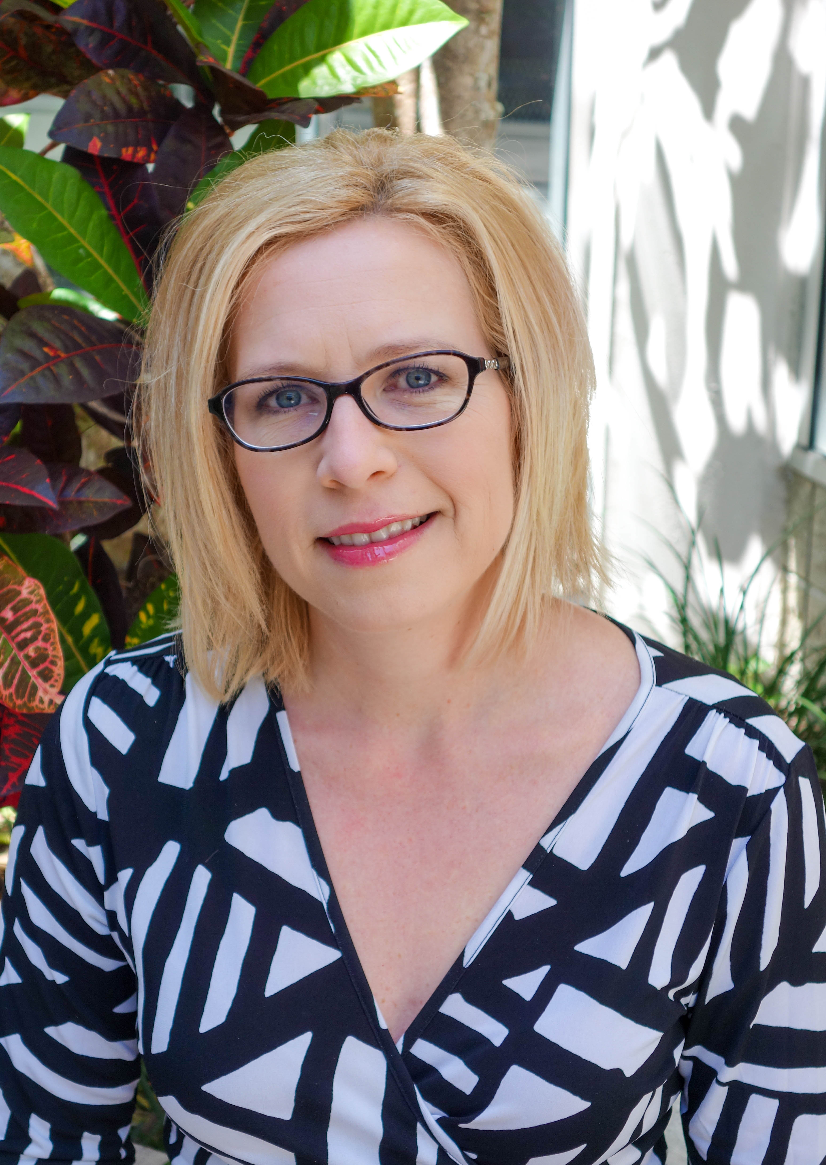 Headshot of Cheryl Vamos in an outdoors setting