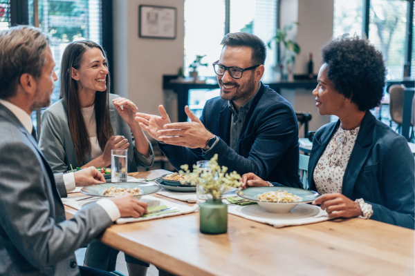 A group of employees eating lunch together.