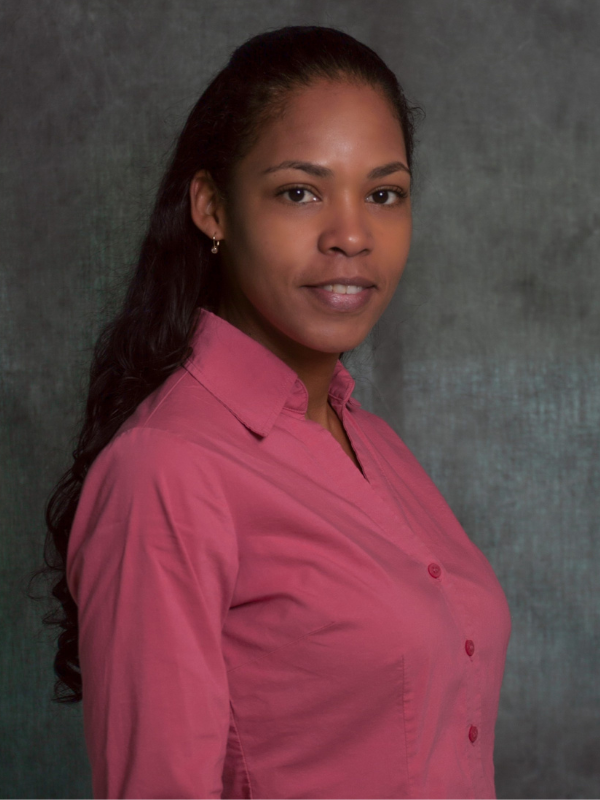 Headshot of Samantha Petzold-Lopez in front of a dark backdrop