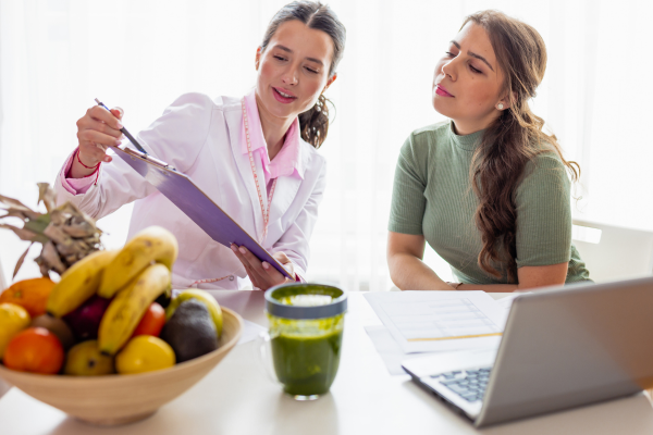 A doctor coaching her patient about health wellness