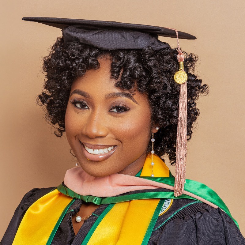Headshot of Ashleigh Bates in graduation regalia