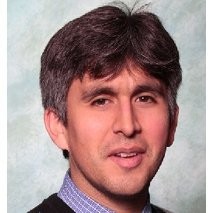 Headshot of Stephan Villavicenico in front of a light backdrop