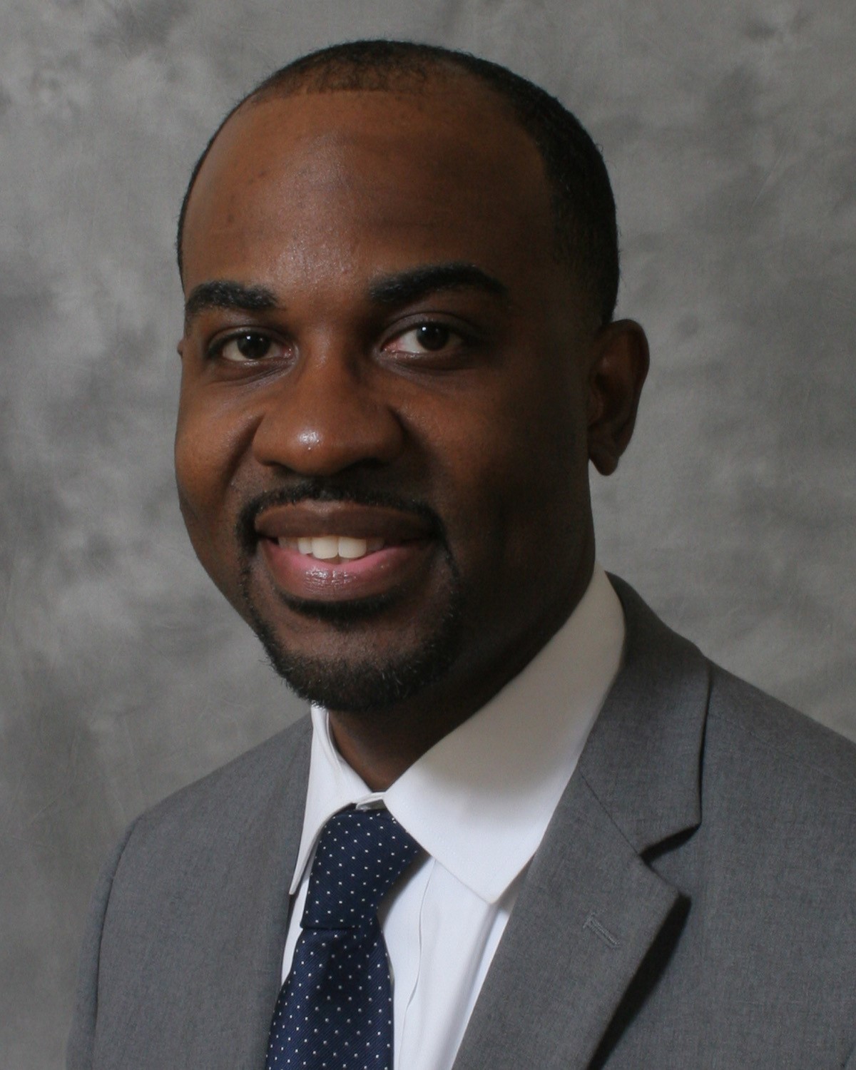 A headshot of Ryan Sledge