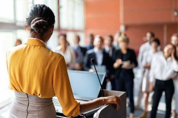 A person giving a presentation in front of a group of people