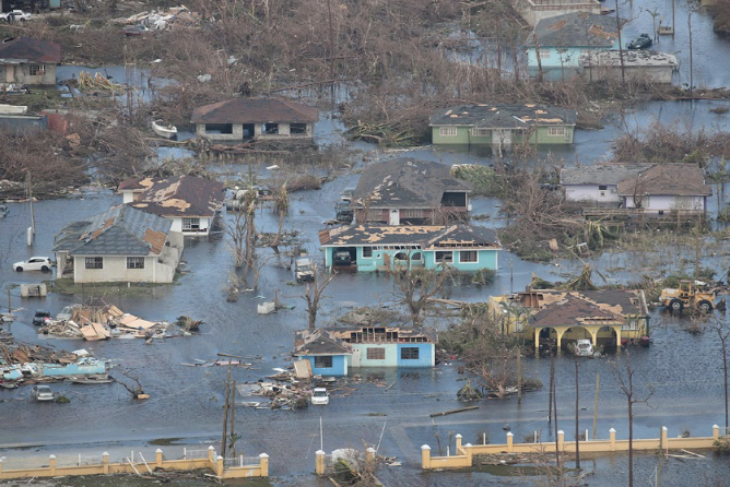 An aerial photo of homes suffering from a flood.