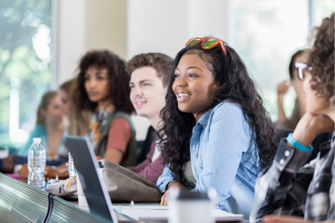 A group of students sitting in a lecture hall