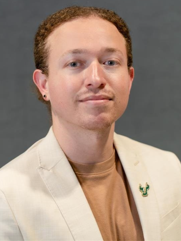 Headshot of Jeff Rodriguez in front of a grey backdrop