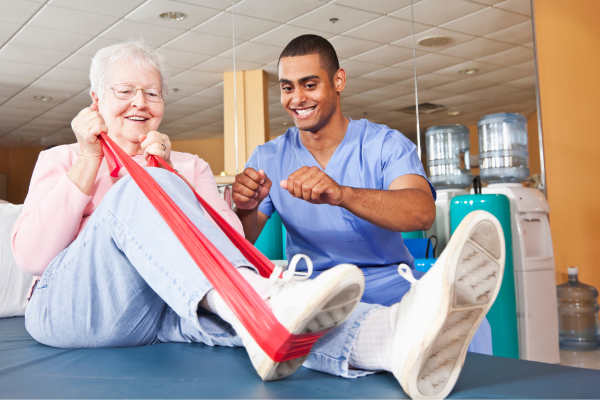 A physical therapist working with a patient