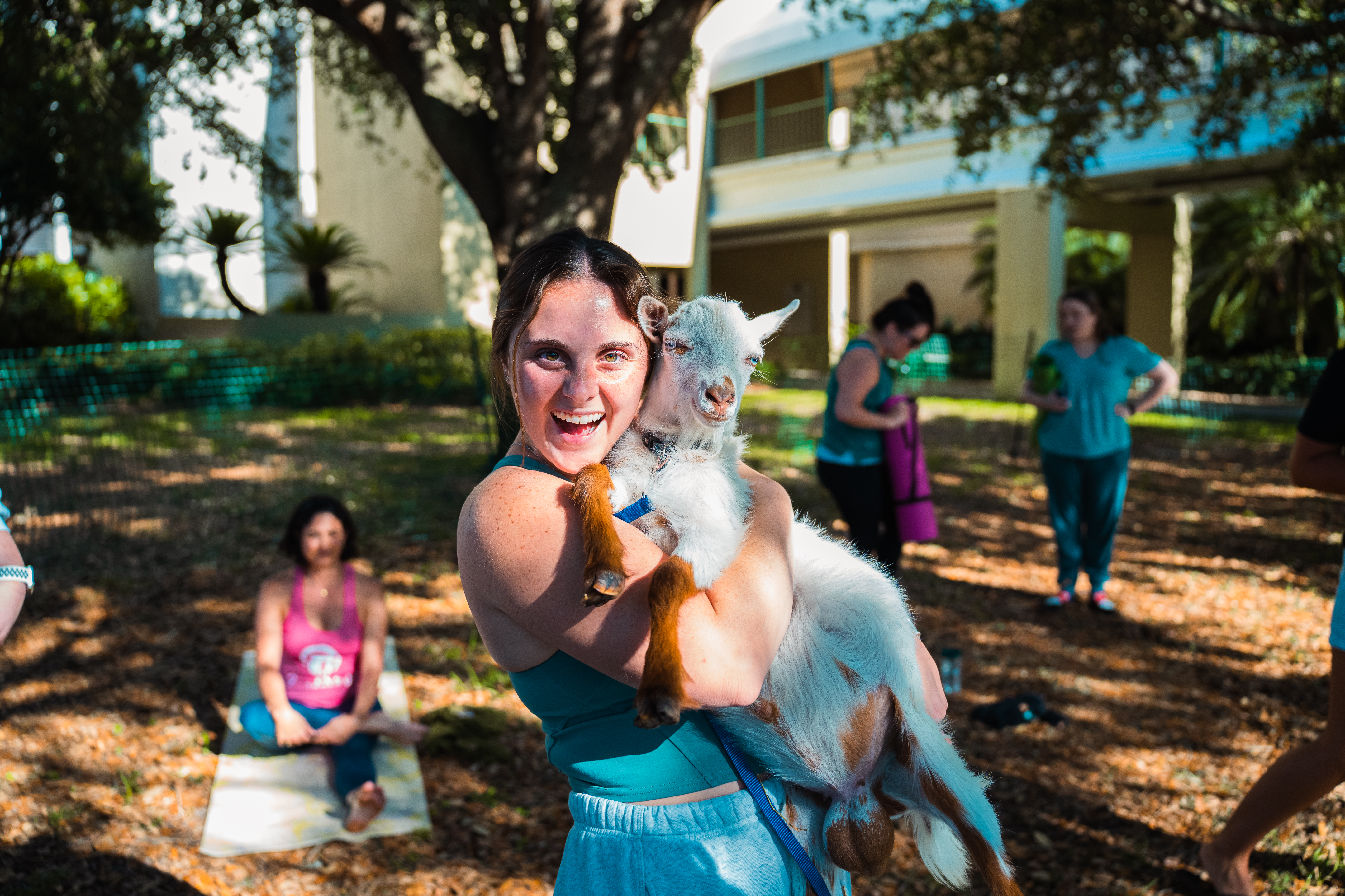 Woman holding a goat