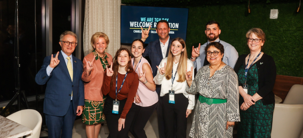 USF and TGH Leadership with Nursing Students holding "go bulls" sign