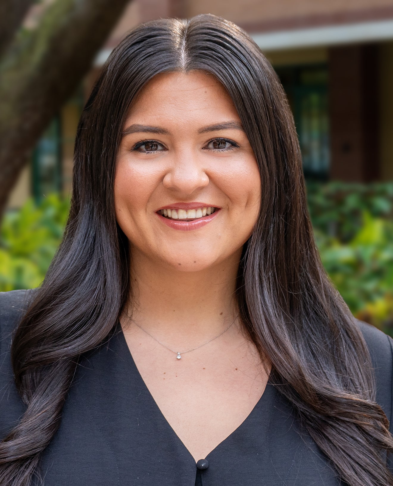 Carina Chavarria smiling wearing a black blouse