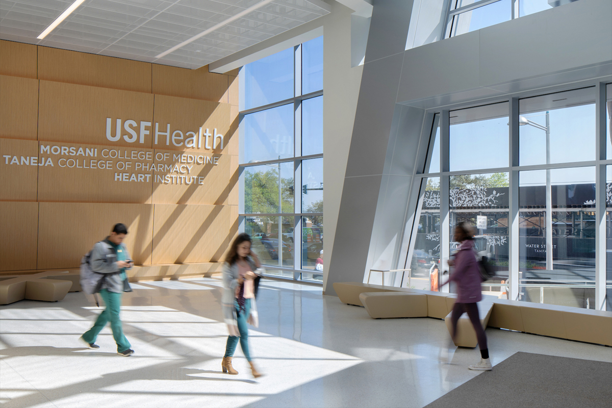 People walking the lobby at the MORSANI College of Medicine building