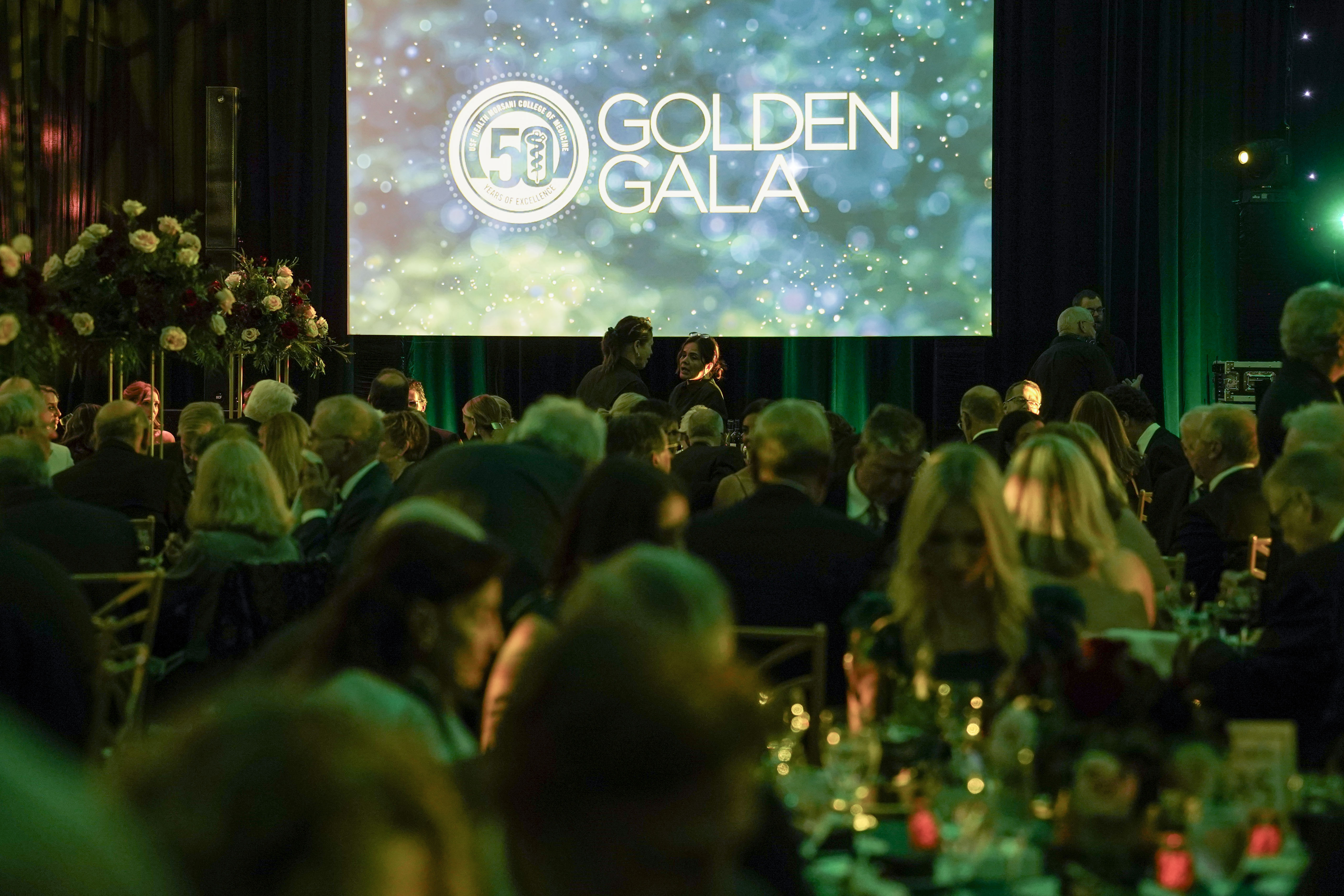 USF Health faculty, staff, students and alumni seated at the 50th Anniversary Golden Gala