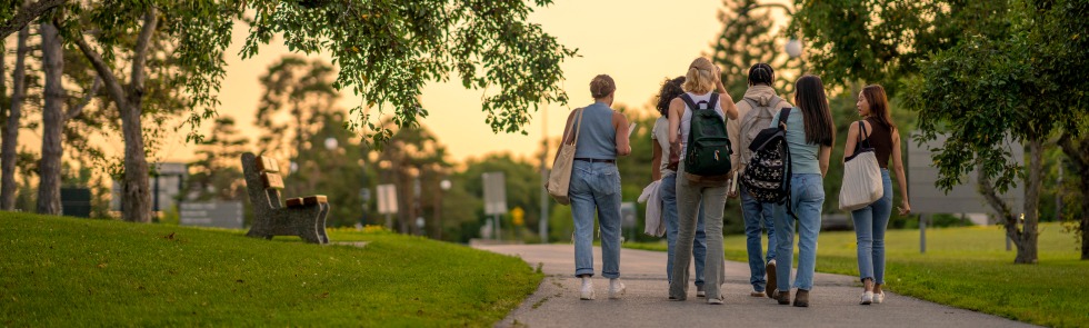 Group of students walking on campus.