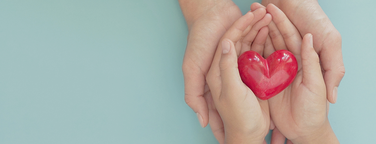 Hands holding heart