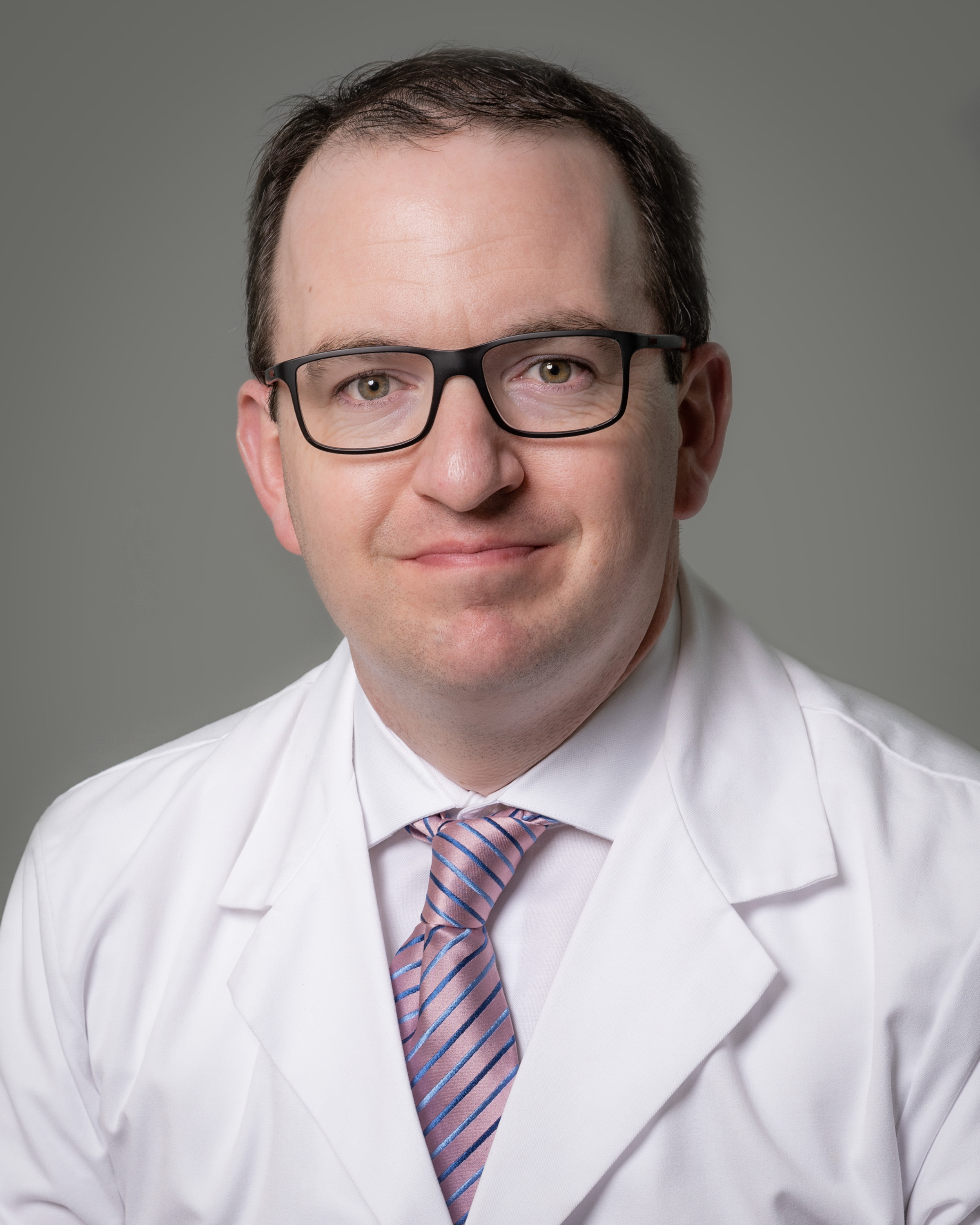 Dr. Keith Dombrowski with USF Health Neurosurgery Fellowship Program