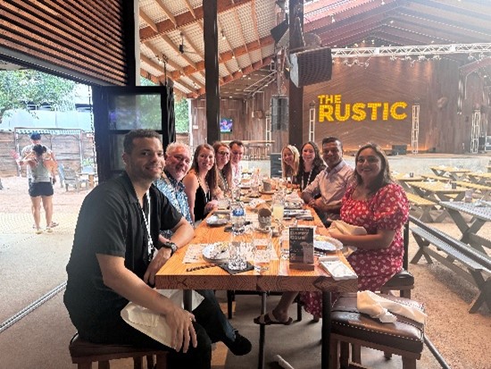 PA Program alumni gathered at a dining table smiling