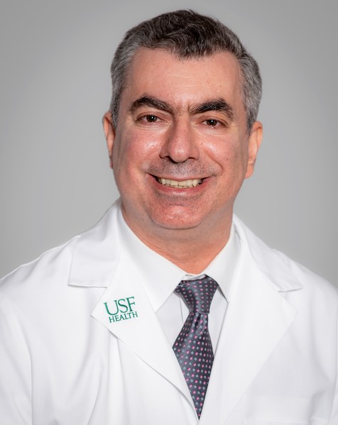 Karachristos headshot wearing a white coat