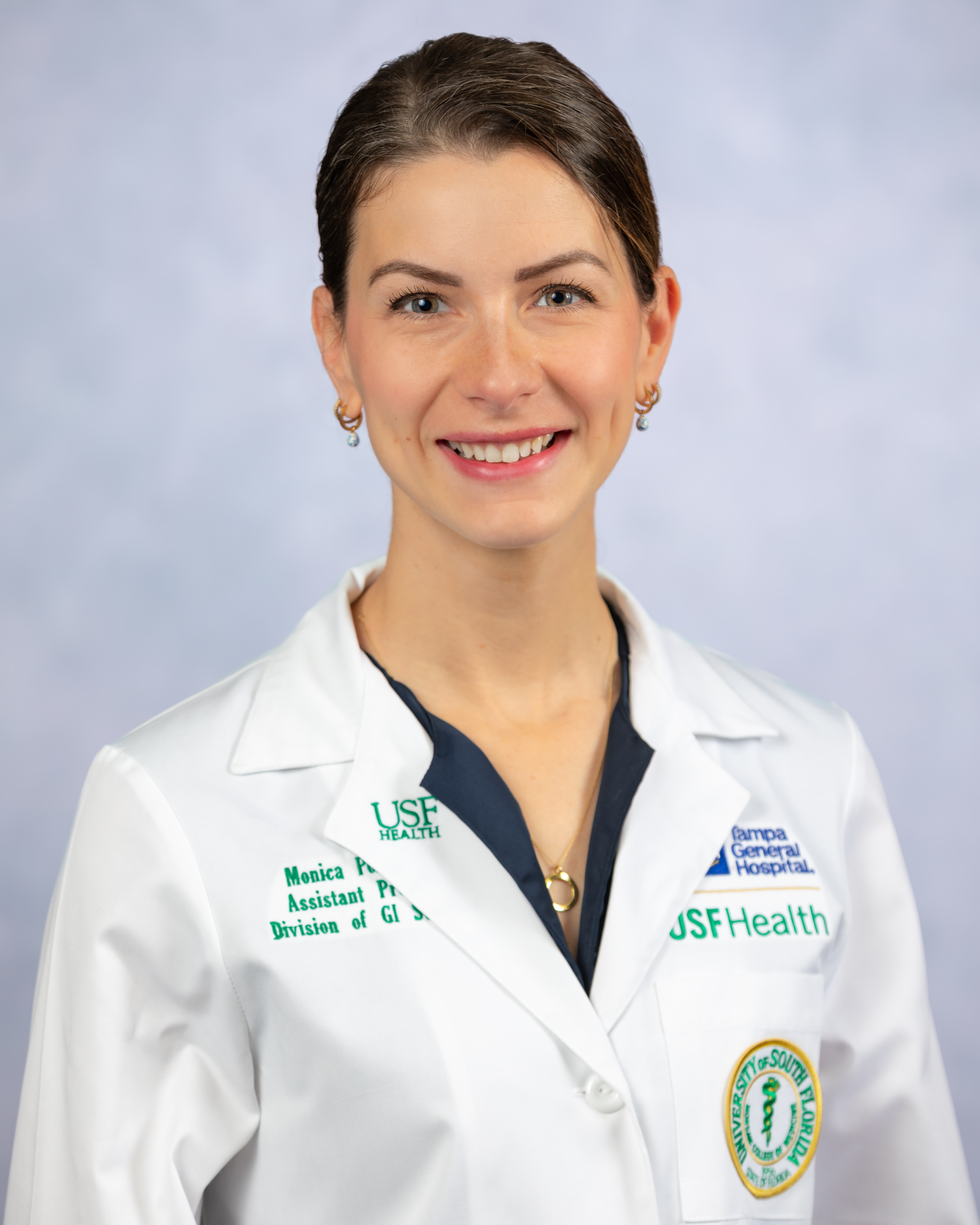headshot of faculty member Monica Polcz wearing a whitecoat