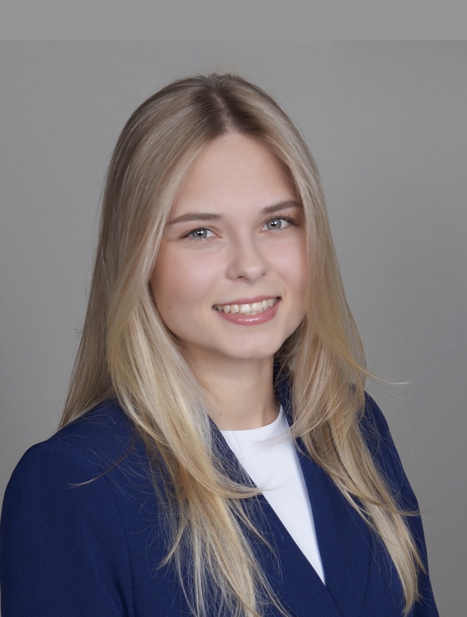 Headshot of Dr. Baran wearing a blue blazer and white shirt