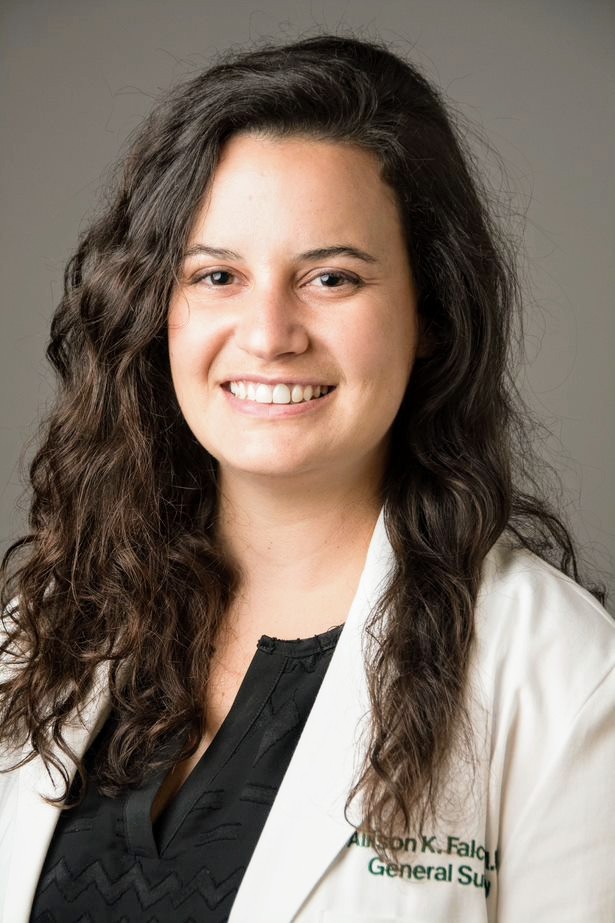 Headshot of Dr. Allison Falcon wearing a whitecoat