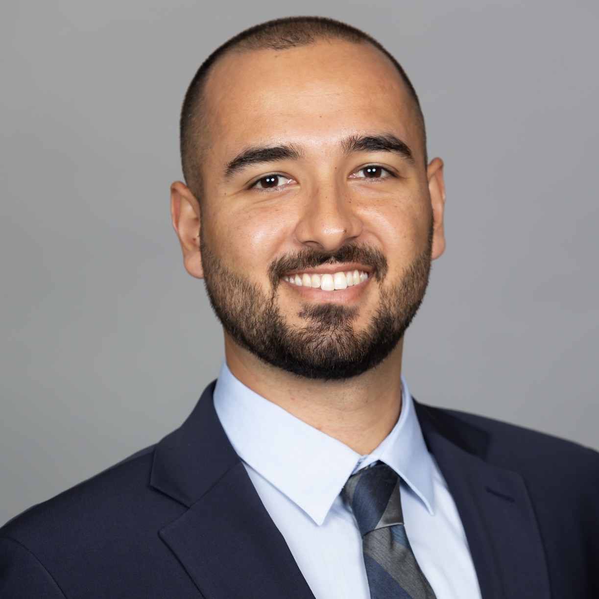 headshot of Ramdev in suit with tie