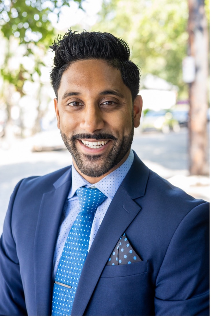 headshot of Wunnava in suit with blue tie