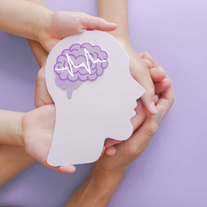 Adult and child hands holding encephalography brain paper cutout,autism, Stroke, Epilepsy, seizure disorder, stroke, ADHD