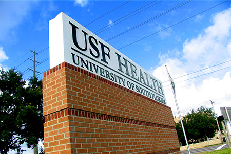 USF Health sign on brick wall