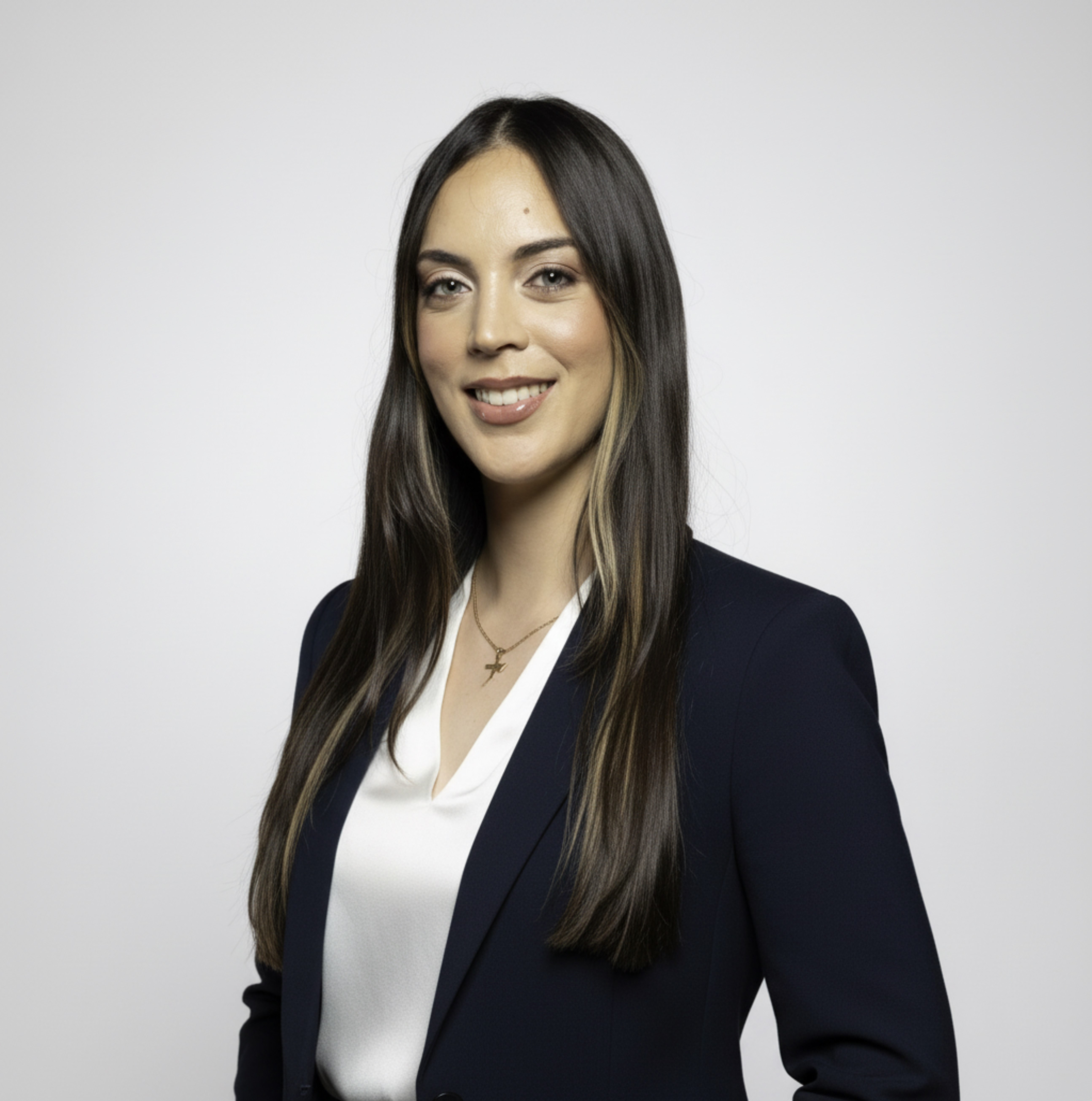 Nohely Hernandez Soto smiling wearing a black blazer and white blouse