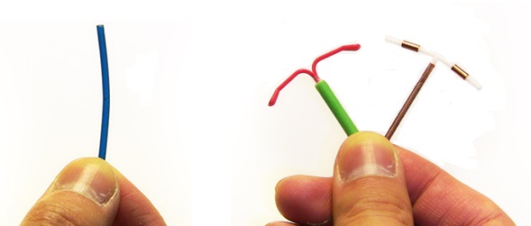 A person holding small medical tools