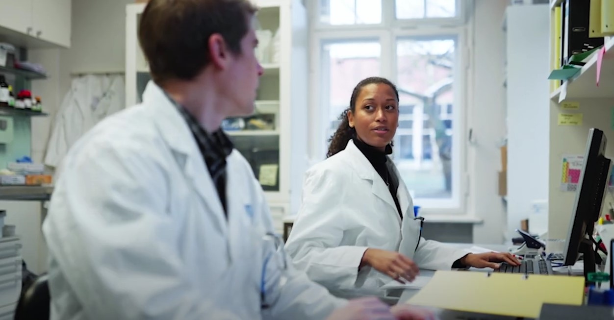 DrPH Clinical Lab Students talking to one another.