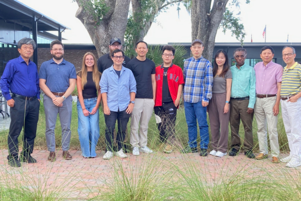 A group of Biostatistics PhD students posing with faculty from the Department of Biostatistics and Data Science.