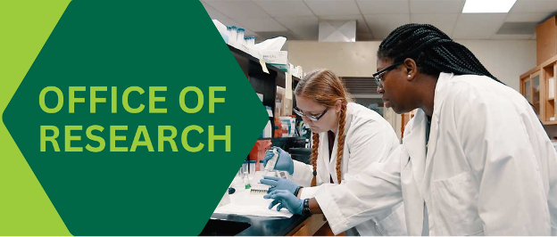 Office of Research: Two women in white coats performing research in a lab.