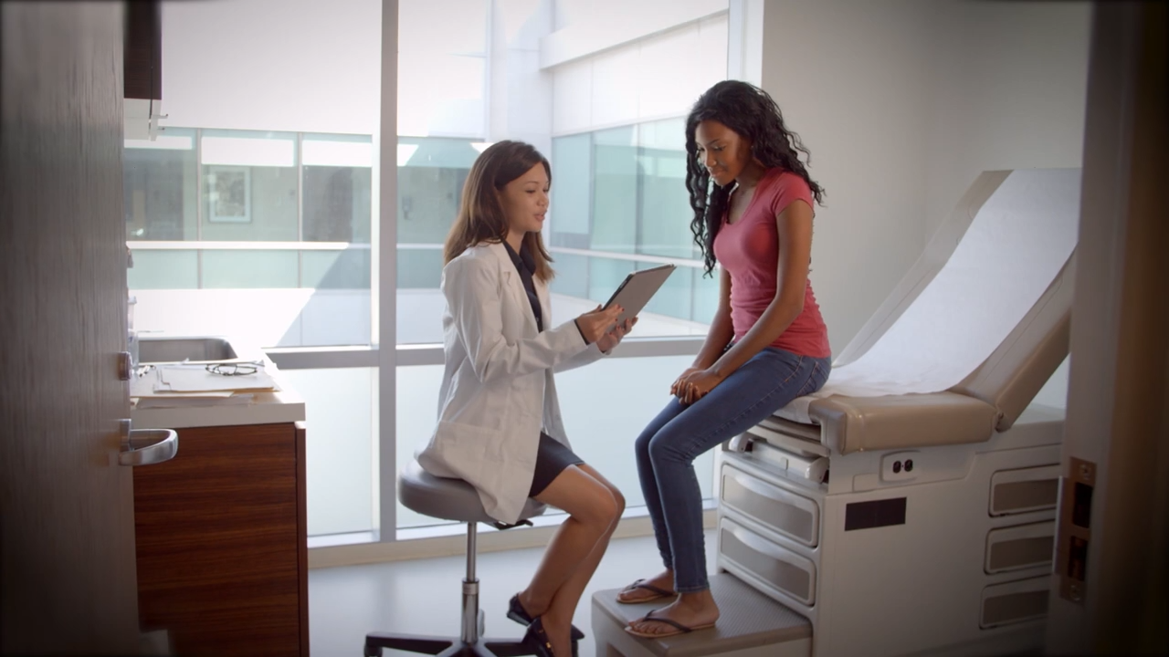 A doctor speaking to a patient