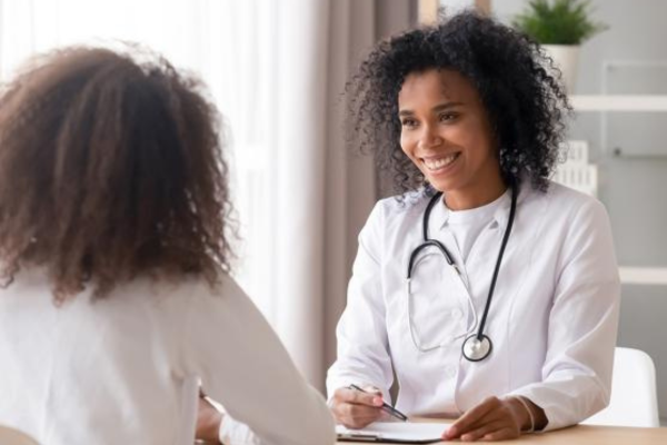 A doctor speaking to her patient.A