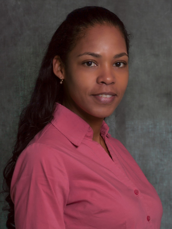 Headshot of Samantha Petzold-Lopez in front of a grey backdrop
