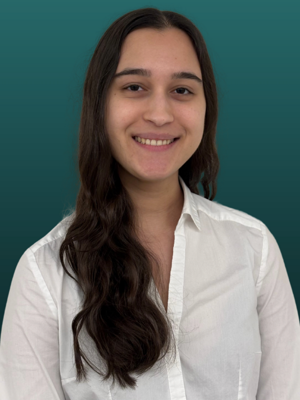 Headshot of Nicole Giboyeaux in front of a green backdrop