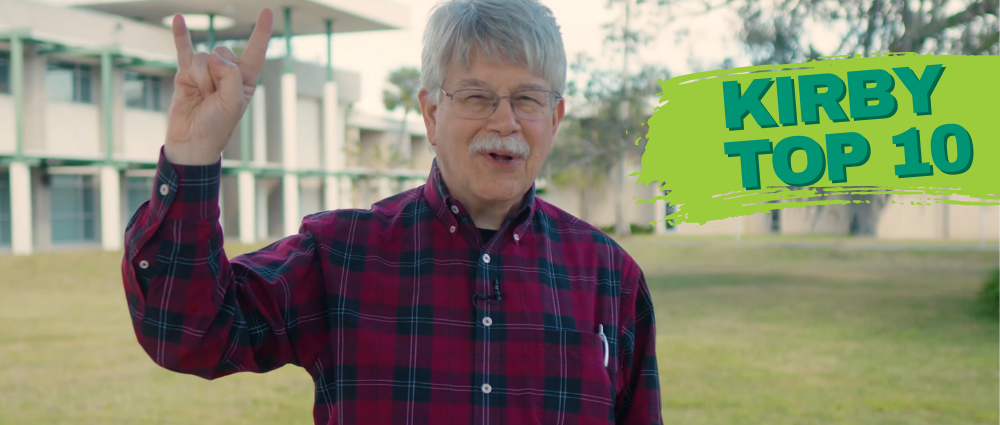 Dr. Russell Kirby holding up the bulls hand symbol next to text that reads Kirby Top 10