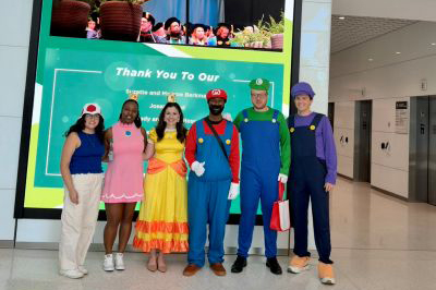 Heart Institute administration dressed as Mario characters at the Morsani College of Medicine Channelside building