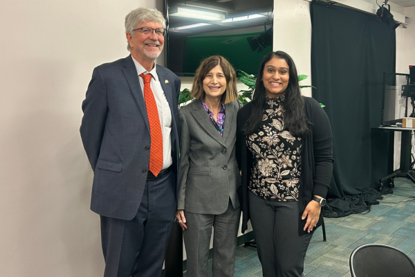 Dr. Liller, Dr. Vermund, and a podcast participant posing together for a photo in the studio.
