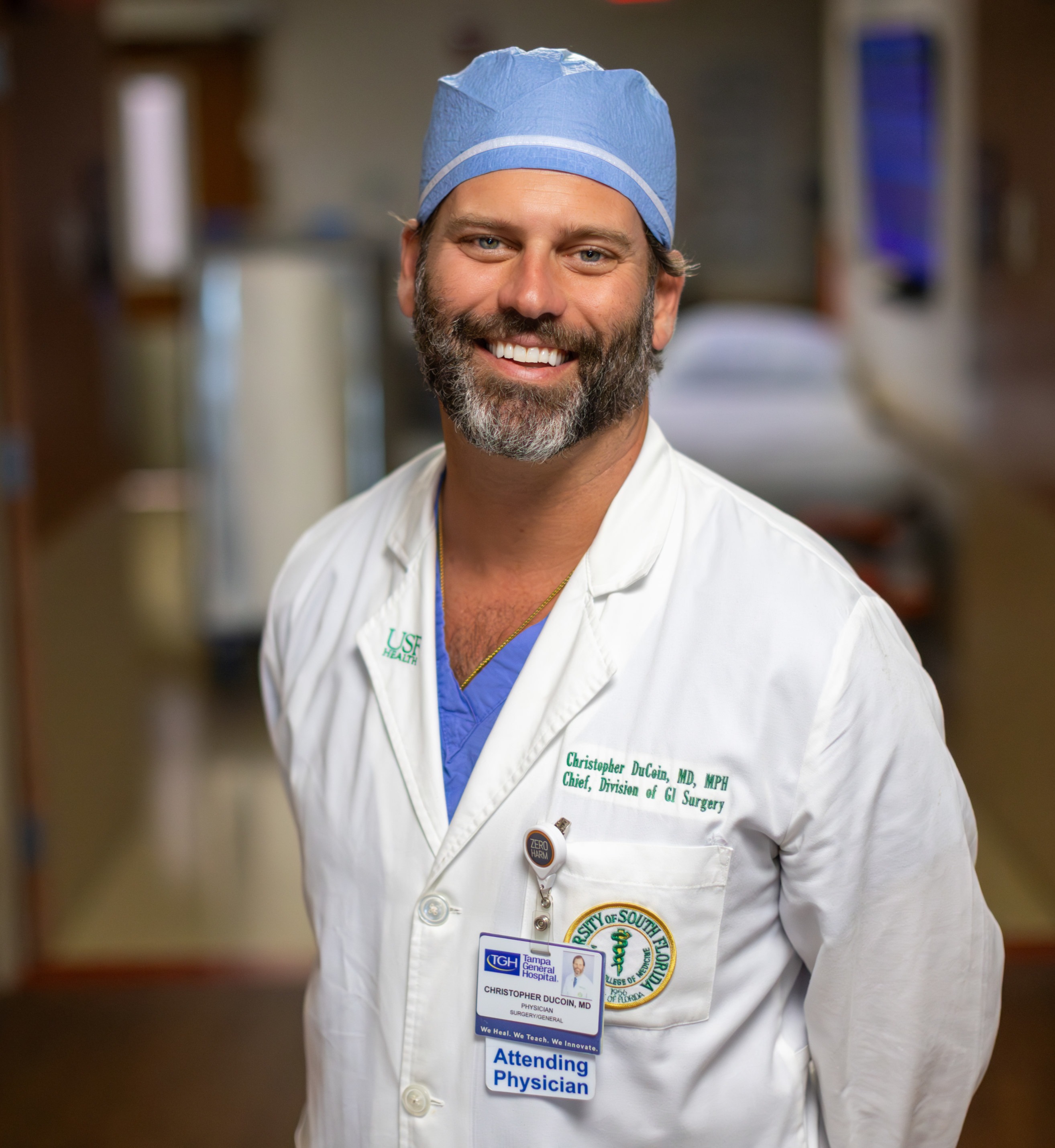 Picture of Dr. DuCoin in a whitecoat and scrub cap