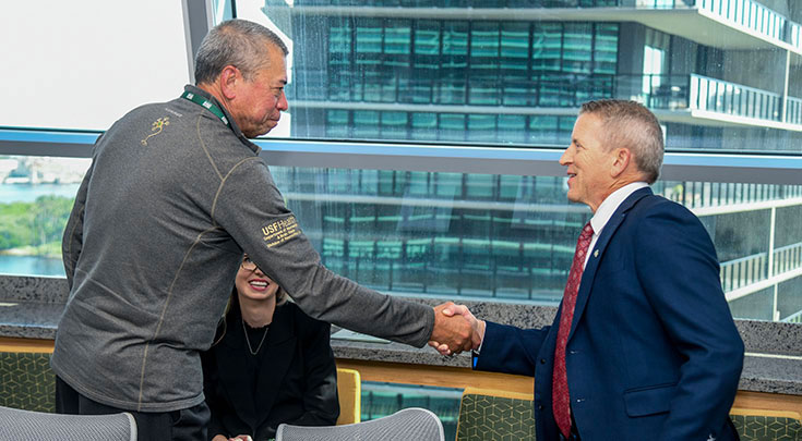Harry van Loveren, MD, chair of the USF Health Department of Neurosurgery and Brain Repair, and interim chair of the Department of Internal Medicine, greets Paul Renner, speaker of the Florida House of Representatives, during Renner's visit to the University of South Florida campuses