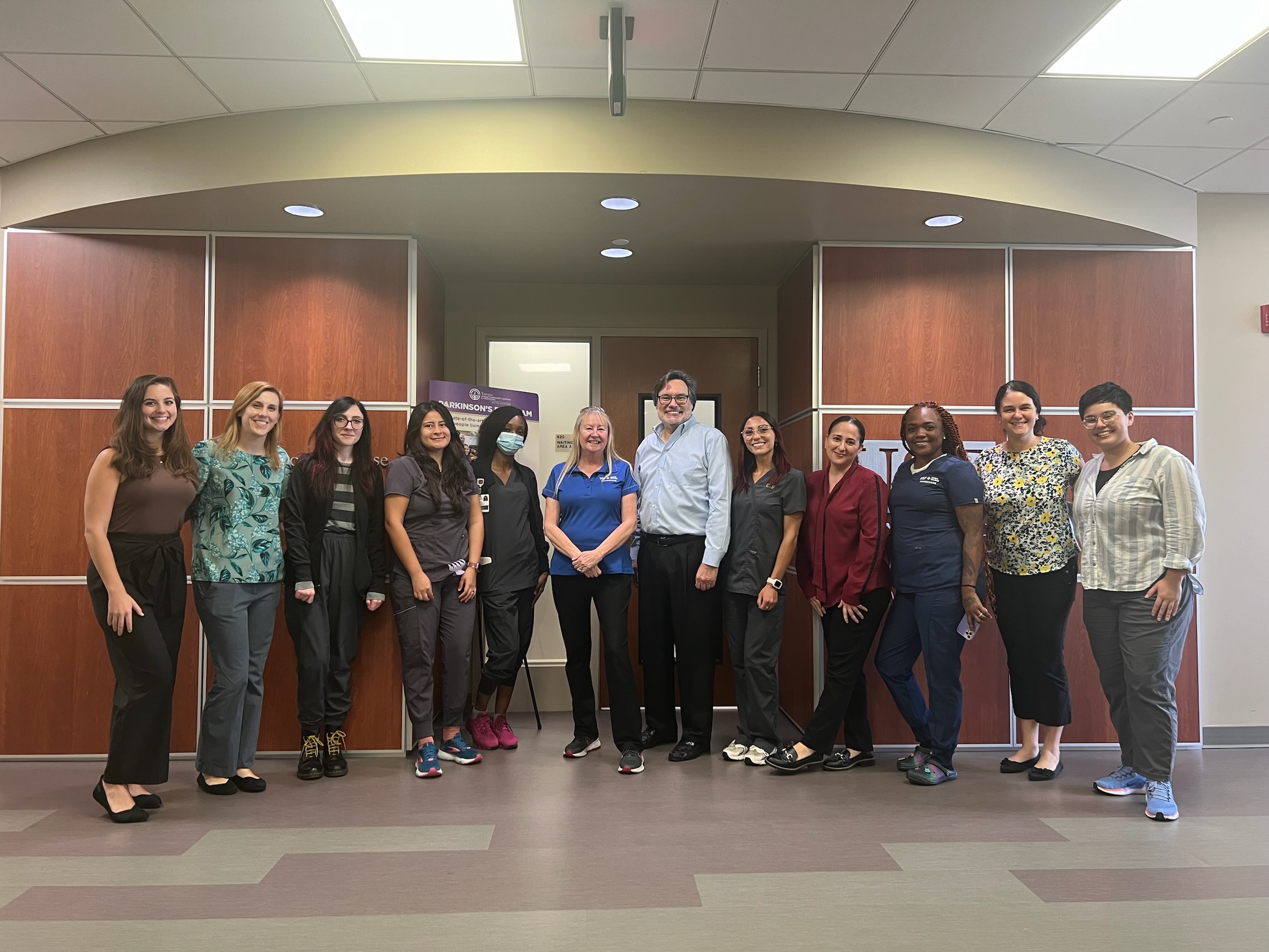 USF Health Parkinson's Disease and Movement Disorders team gathered in a horizontal line