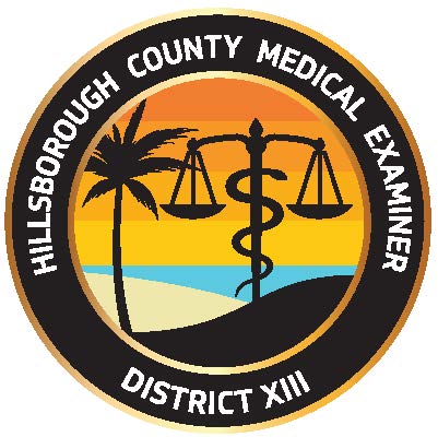 Tropical scene with palm tree and snake wrapped around the base of a double-sided weight with text that reads: Hillsborough County Medical Examiner District XIII